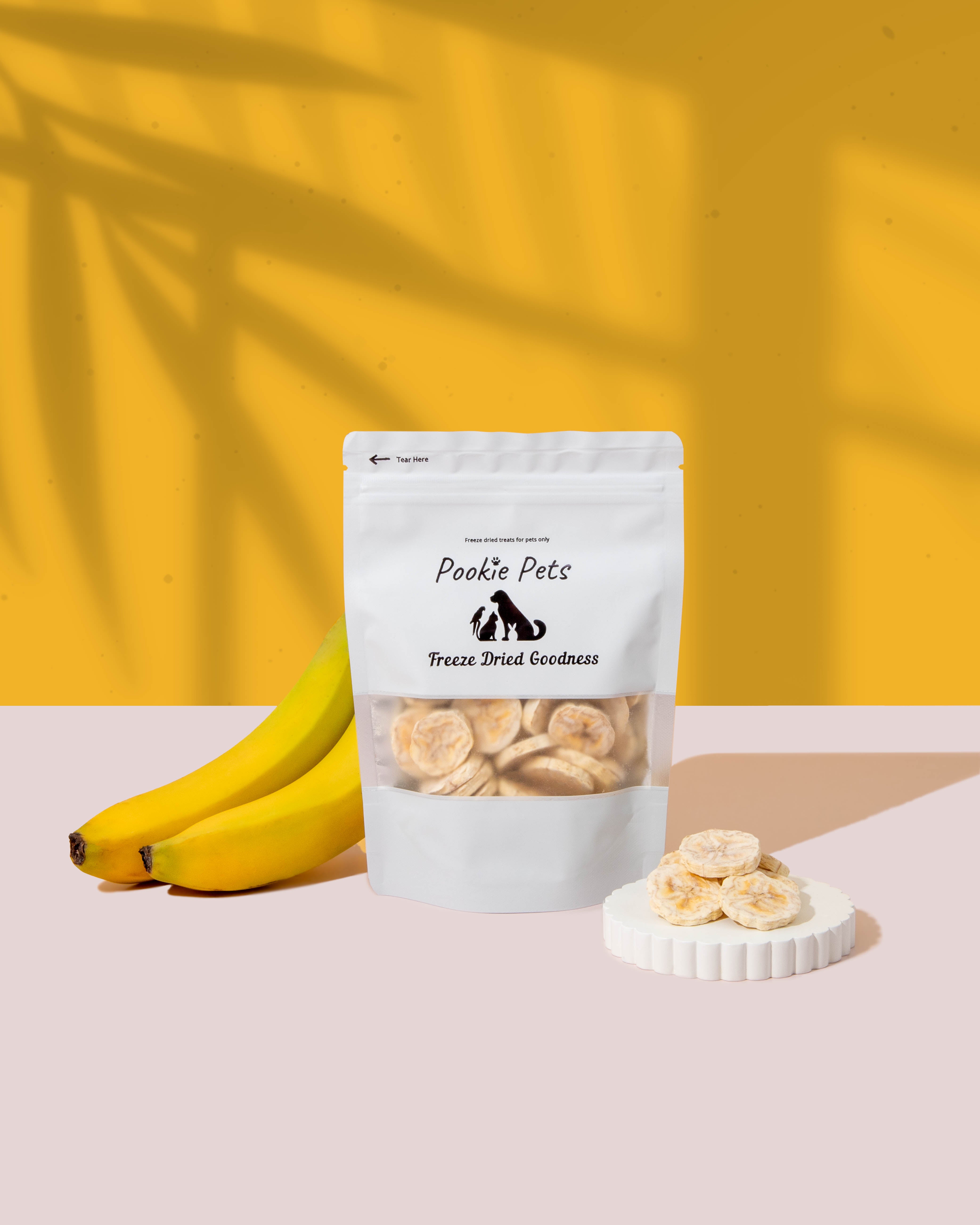 Freeze-dried banana chips for pets – crunchy, sweet yellow fruit snack in white packaging by Pookie Pets