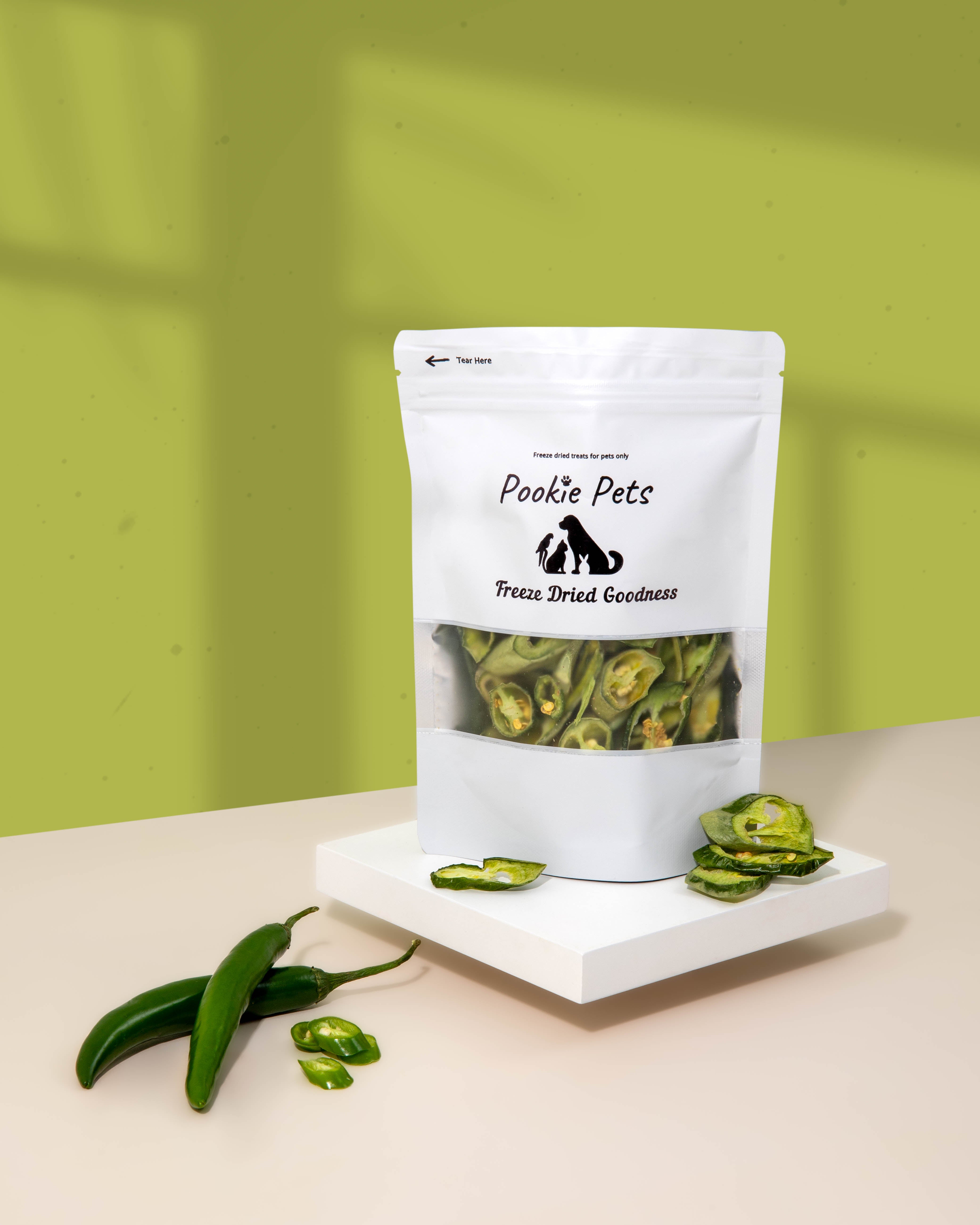 Freeze-dried red chili peppers for parrots – spicy, antioxidant-rich raw bird treat in packaging by Pookie Pets